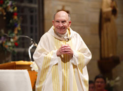 Father Joseph Kern smiles as he celebrates Mass at St. Margaret Mary Church in Terre Haute, part of the joy that has marked his 50 years as a priest. (Submitted photo) 