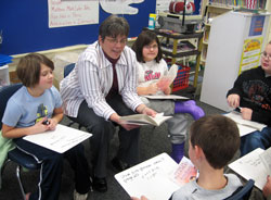 Eight teachers, Suzi Abell, Marsha Austin, Kathryn Jacobi, Sandi Kirchner, Donna Lathrop, Connie Schmidt, Jacque Singleton and Jackie Swihart, from across the archdiocese were recently recognized as winners of the Saint Theodora Excellence in Education Award. Above, Sandi Kirchner of St. Mary School in North Vernon teaches her third-grade students. On the day before she received her award, she stopped a car that veered out-of-control near the school. (Submitted photo) 