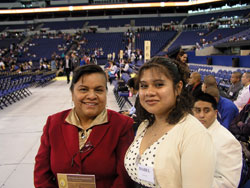 Lucy Rocha, left, and Mirna Catalan pose for a picture before the anniversary celebration. Rocha was the confirmation sponsor for Catalan, one of 35 Hispanics from Holy Spirit Parish in Indianapolis who were confirmed during the 175th anniversary Mass on May 3. (Photo by John Shaughnessy) 