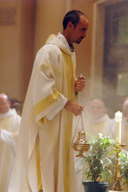 Deacon Christopher Wadelton incenses the congregation during the Chrism Mass on April 7 at SS. Peter and Paul Cathedral in Indianapolis. (File photo by Sean Gallagher) 