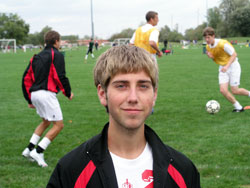 Reese Gillund poses on Sept. 28 at Lawrence Park in Indianapolis while his teammates on the boys’ soccer team of Cardinal Ritter Jr./Sr. High School in Indianapolis practice together. (Photo by John Shaughnessy) 