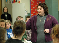 St. Bartholomew parishioner Kayla McClaine, a Columbus East High School senior, passes out pro-life literature to teenagers during “Keep the Fire Burning,” a pro-life rally she organized for her community service project. Kayla said she hopes the teenagers will share the pro-life information with other young people, which could help save the lives of unborn babies. (Photo by Mary Ann Wyand)