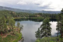 Clouds roll in over mountains and a lake along the scenic route of the Durango and Silverton Narrow Gauge Railroad train ride to and from the former mining towns in southwestern Colorado. (Photo by Mary Ann Wyand)