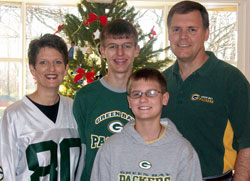 Shelley, Josef, Joshua and Daniel Herkert, members of St. Mark the Evangelist Parish in Indianapolis, pose for a family photo in their home. Shelley, Josef and Daniel will be part of the fifth annual Race for Vocations team when they run the OneAmerica 500 Festival Mini-Marathon on May 5 in Indianapolis. Joshua will support his family as part of a cheering section for the team during the 13.1-mile race. (Submitted photo)