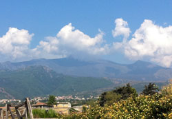 Smoke rises from craters in Mount Etna, Sicily’s active volcano, which last erupted in 2006. (Submitted photo by Regina Fink)