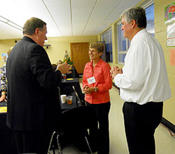 Archbishop Joseph W. Tobin greets Danny and Mary Chris Rodden, parents of seminarian Kyle Rodden, at the Oct. 27 dinner following the Miter Society Mass at Holy Family Church in New Albany. (Photo by Patricia Happel Cornwell)