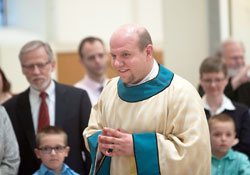 Deacon Andrew Syberg smiles after being ordained a transitional deacon at the Archabbey Church of Our Lady of Einsiedeln in St. Meinrad on April 26, 2014. Deacon Syberg will be ordained to the priesthood by Archbishop Joseph W. Tobin on June 6 at SS. Peter and Paul Cathedral in Indianapolis. (Submitted photo courtesy of Saint Meinrad Archabbey)