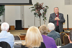 Cullen Larson of Catholic Relief Services speaks on the topic of Syrian and Iraqi refugees at Our Lady of the Greenwood Parish in Greenwood on Oct. 14. (Photo by Natalie Hoefer)