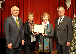 Indiana Historical Society chairman of the board of trustees David Evans, left, poses with St. Elizabeth/Coleman Pregnancy and Adoptive Services agency director Renee Hummel, St. Elizabeth/Coleman director of community relations Priscilla Kamrath, and Catholic Charities Indianapolis director David Bethuram as they accept the IHS Centennial Business Award on Dec. 7 in Indianapolis. (Photo by Natalie Hoefer)