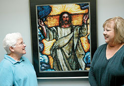 Phyllis McNamara, left, has led a Catholic prayer program called Oremus at Christ the King Parish in Indianapolis—a program designed to help people develop a closer relationship with God. Here, she talks with Cindy Flaten, director of religious education at the parish. (Photo by John Shaughnessy)