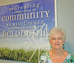 Franciscan Sister Jackie McCracken stops for a photo inside the Village of Merici, the Indianapolis residential setting where she helps adults with disabilities navigate their lives. (Photo by John Shaughnessy)