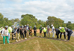 Archbishop Charles C. Thompson, center, joins others in breaking ground for the Indianapolis faith community’s new church during a ceremony on Sept. 26. (Photo by Natalie Hoefer)