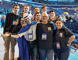 During her 12 years as the youth minister of Our Lady of the Greenwood Parish in Greenwood, Patty Schnarr helped teenagers in their faith journeys. Here, she posed with youth members of the parish during the 2017 National Catholic Youth Conference in Indianapolis. (Submitted photo)