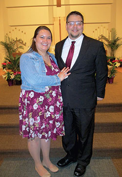 Brian Hall smiles with his sponsor and fiancée Cari Weibel in St. Lawrence Church in Indianapolis after being received into the full communion of the Church during the Easter Vigil Mass on April 3. (Submitted photo by Sandra Hartlieb)