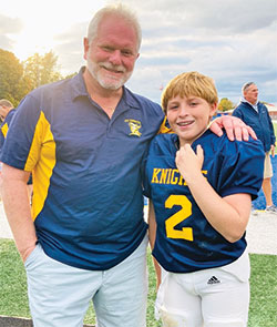 Coach Mark Bridges and one of his players, Gino Duncan, are all smiles for a photo. (Submitted photo)