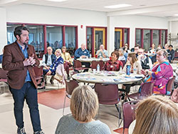 Timothy O’Malley, director of education at the McGrath Institute for Church Life at the University of Notre Dame, gives a presentation on the Eucharist to archdiocesan leaders in catechesis, youth ministry and college campus ministry on March 1 at St. Paul Catholic Center in Bloomington. (Photo by Sean Gallagher)