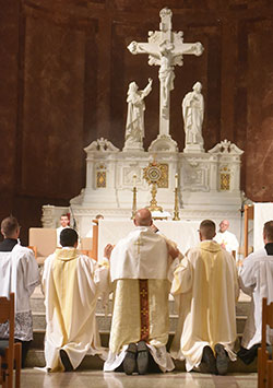 Father Michael Keucher, center, archdiocesan director of vocations, incenses the Blessed Sacrament on Aug. 3, 2022, at SS. Peter and Paul Cathedral in Indianapolis during a Day of Prayer with St. John Vianney for priestly vocations. (File photo by Sean Gallagher)